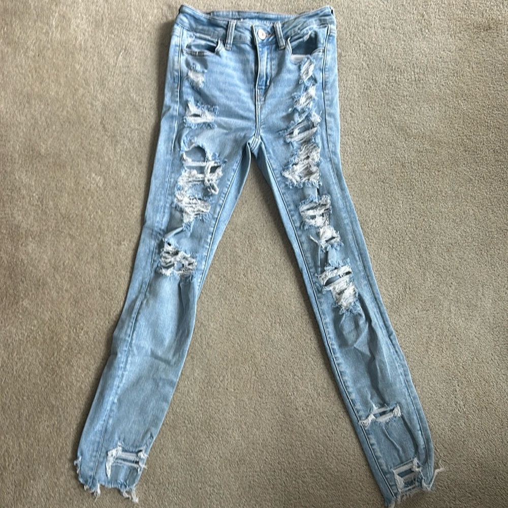 American Eagle Next Level Stretch Jeans. Distressed. Light Blue Wash. Size 4